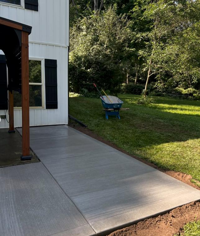 Side patio slab, broom finish — concrete work by Loaded Construction in metro Detroit