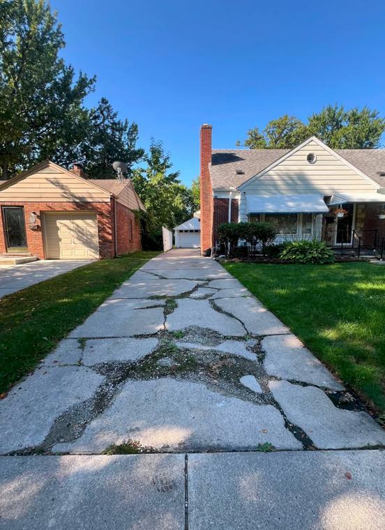 Before — cracked, failed slab — concrete work by Loaded Construction in metro Detroit