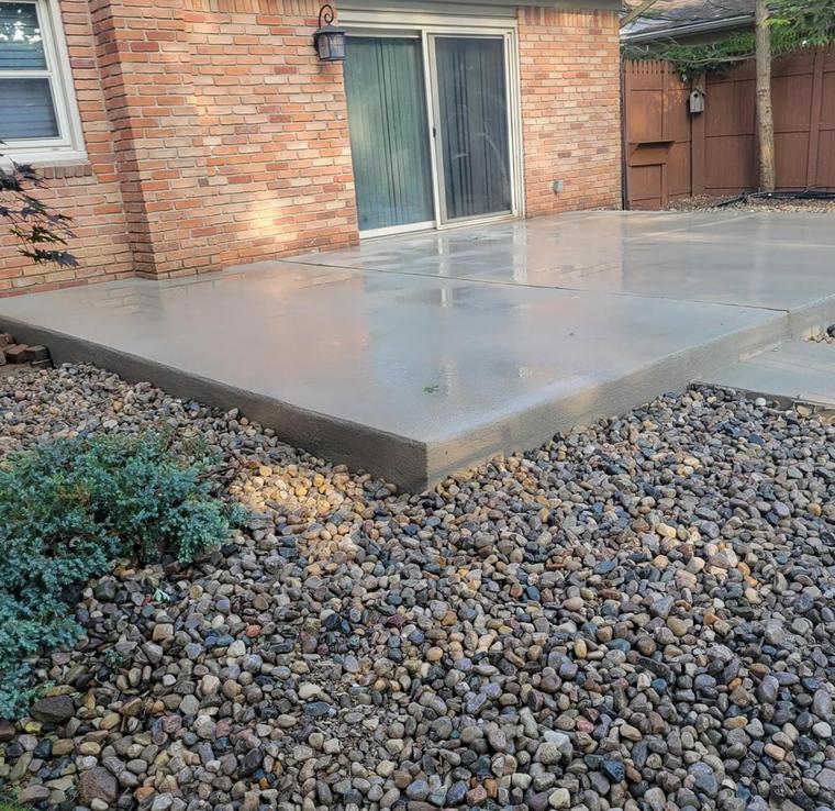 Raised patio slab on a brick ranch — concrete work by Loaded Construction in metro Detroit