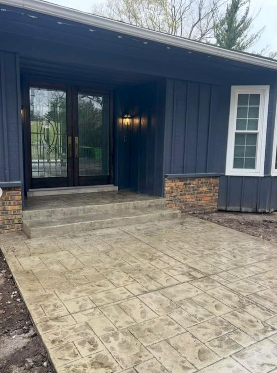 Stamped ashlar entry porch — concrete work by Loaded Construction in metro Detroit