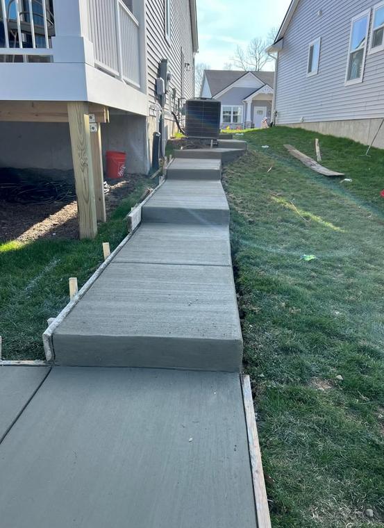 Side walkway with poured steps — concrete work by Loaded Construction in metro Detroit